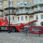 skip truck dropping 8 yard skip on sion hill